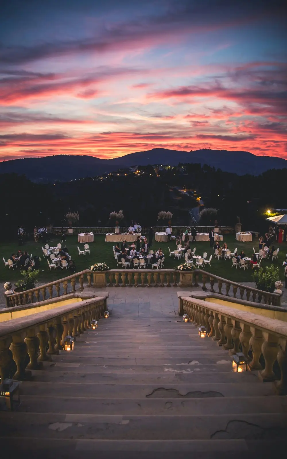 The villa terrace at sunset, laid for dinner